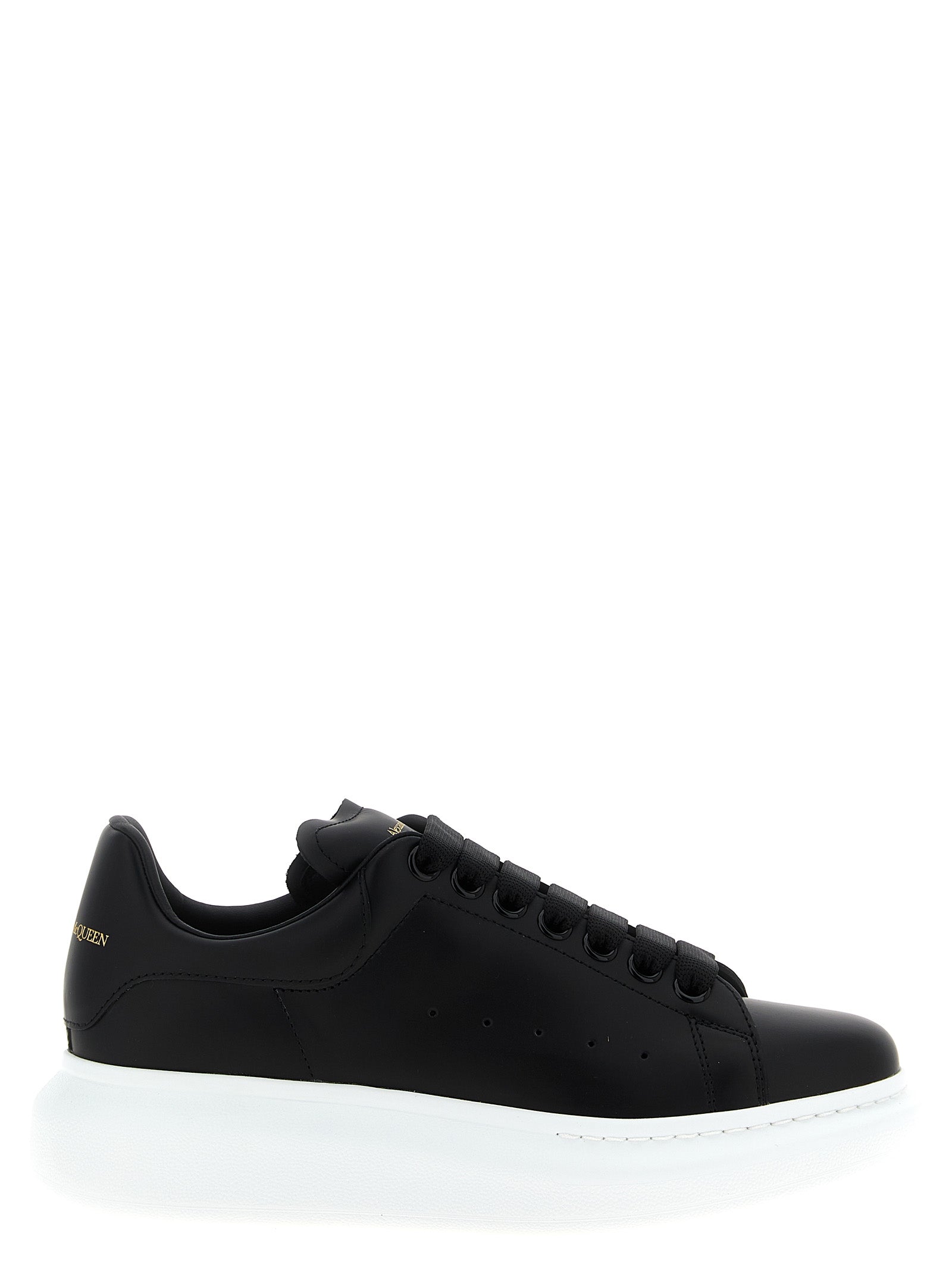 Sneakers by Alexander McQueen for women in bos taurus leather bicolour, black & white presents a on trend silhouette from the Women's Low Top Bos Taurus Leather Sneakers collection, showcasing a on trend low-top style for an elevated aesthetic.