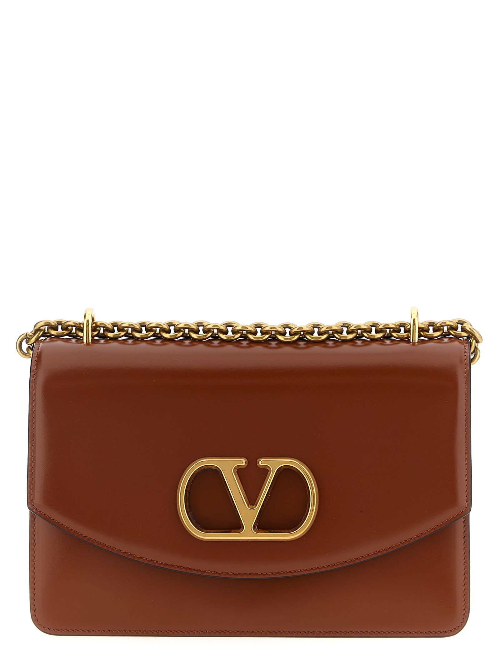Shoulder Flap Bag by Valentino Garavani for women in nappa calfskin leather brown & signature features a effortless chic silhouette with a secure flap & magnetic, ample , and versatile shoulder-strap for a effortless chic finish.