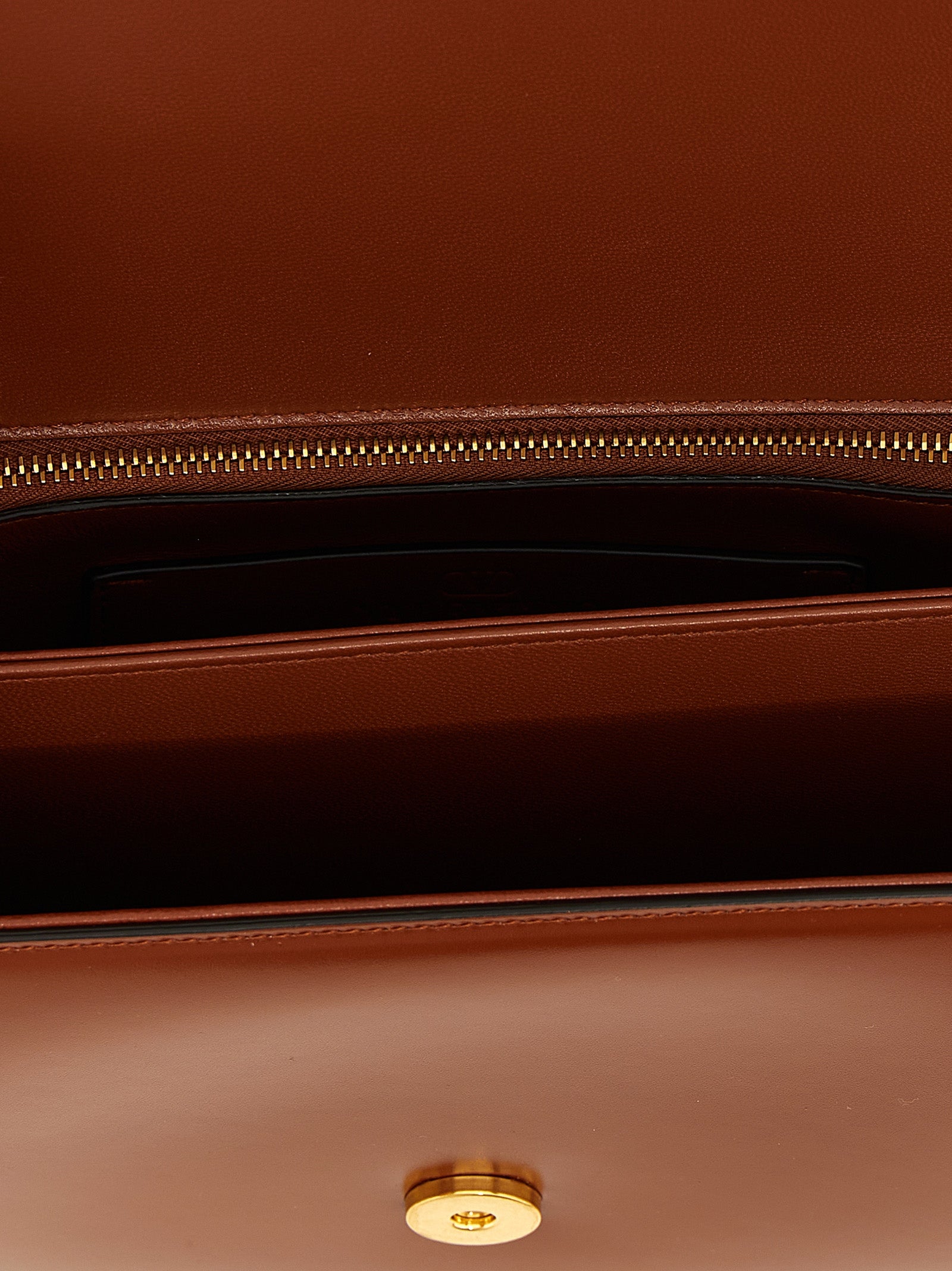 Shoulder Flap Bag by Valentino Garavani for women in nappa calfskin leather brown & signature features a effortless sophistication silhouette, secured by a flap & magnetic with ample and versatile shoulder-strap for a effortless sophistication finish.