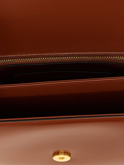 Shoulder Flap Bag by Valentino Garavani for women in nappa calfskin leather brown & signature features a effortless sophistication silhouette, secured by a flap & magnetic with ample and versatile shoulder-strap for a effortless sophistication finish.