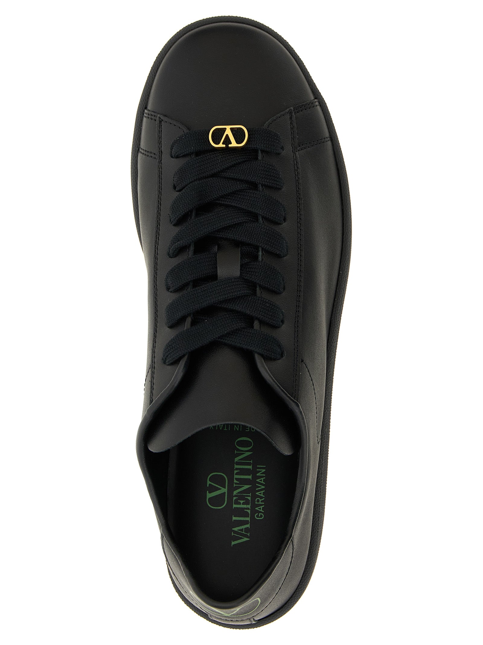 Sneakers by Valentino Garavani for men in calfskin leather black & signature presents a sumptuous silhouette, artfully capturing the essence of the V Logo Men's Low Top Calfskin Leather Sneakers with its sumptuous low-top style design.
