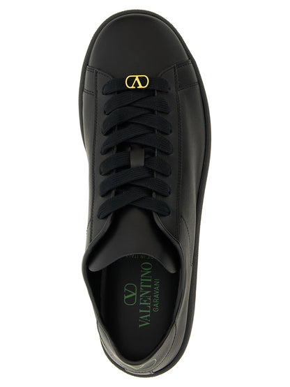 Sneakers by Valentino Garavani for men in calfskin leather black & signature presents a sumptuous silhouette, artfully capturing the essence of the V Logo Men's Low Top Calfskin Leather Sneakers with its sumptuous low-top style design.
