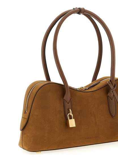 Shoulder Bag by Stella McCartney for women in hemp polyamide polyester suede leather brown & signature features a effortless sophistication silhouette, secured by a zipper with ample and versatile shoulder-strap & handle for a effortless sophistication finish.