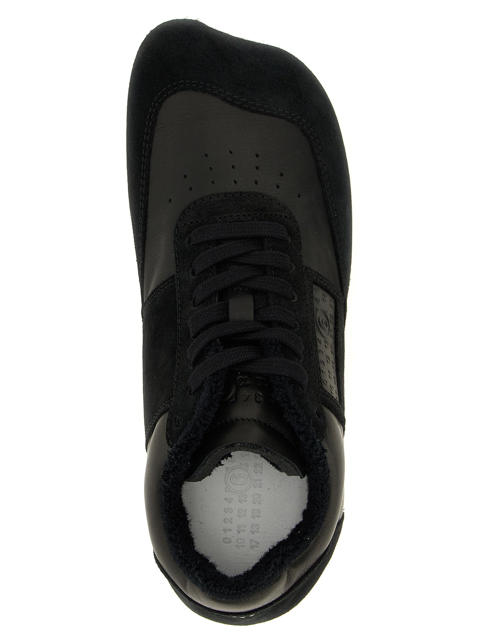 Athletic Sneakers by MM6 Maison Margiela for men in calfskin leather black, white & signature showcases a architectural silhouette, artfully capturing the essence of the Men's Athletic Calfskin Leather Sneakers with its signature architectural athletic style construction.