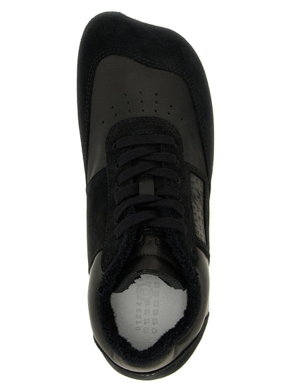 Athletic Sneakers by MM6 Maison Margiela for men in calfskin leather black, white & signature showcases a architectural silhouette, artfully capturing the essence of the Men's Athletic Calfskin Leather Sneakers with its signature architectural athletic style construction.