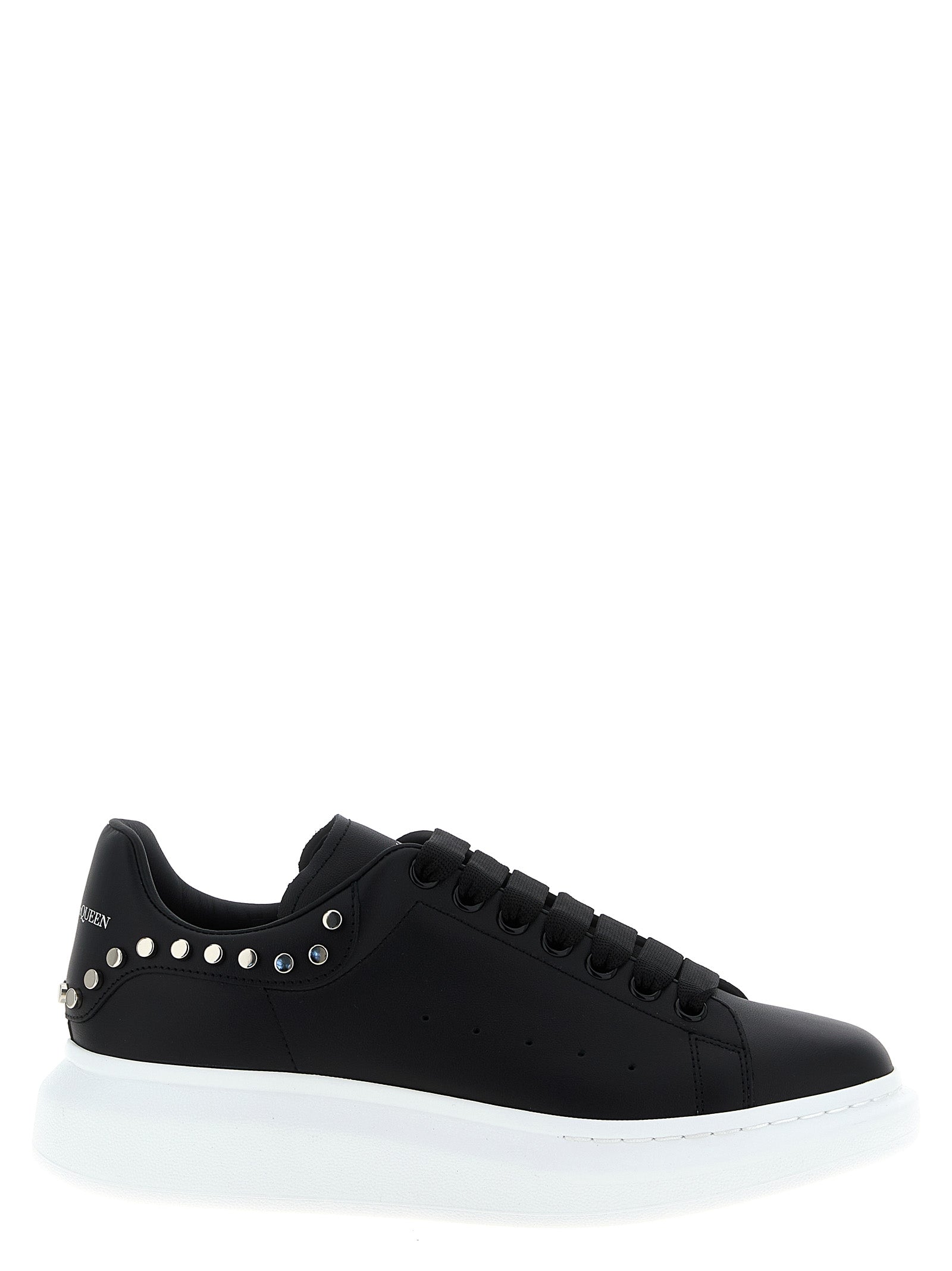Sneakers by Alexander McQueen for men in calfskin leather black features an timeless silhouette from the Men's Chunky Calfskin Leather Sneakers collection, showcasing a signature chunky style with an timeless finish.