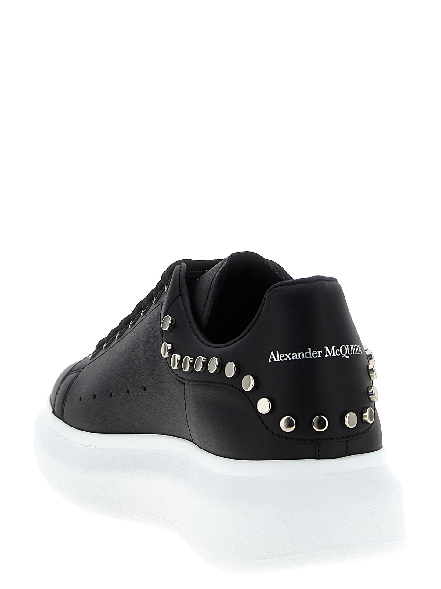 Sneakers by Alexander McQueen for men in calfskin leather black presents a sumptuous silhouette, artfully capturing the essence of the Men's Chunky Calfskin Leather Sneakers with its sumptuous chunky style design.