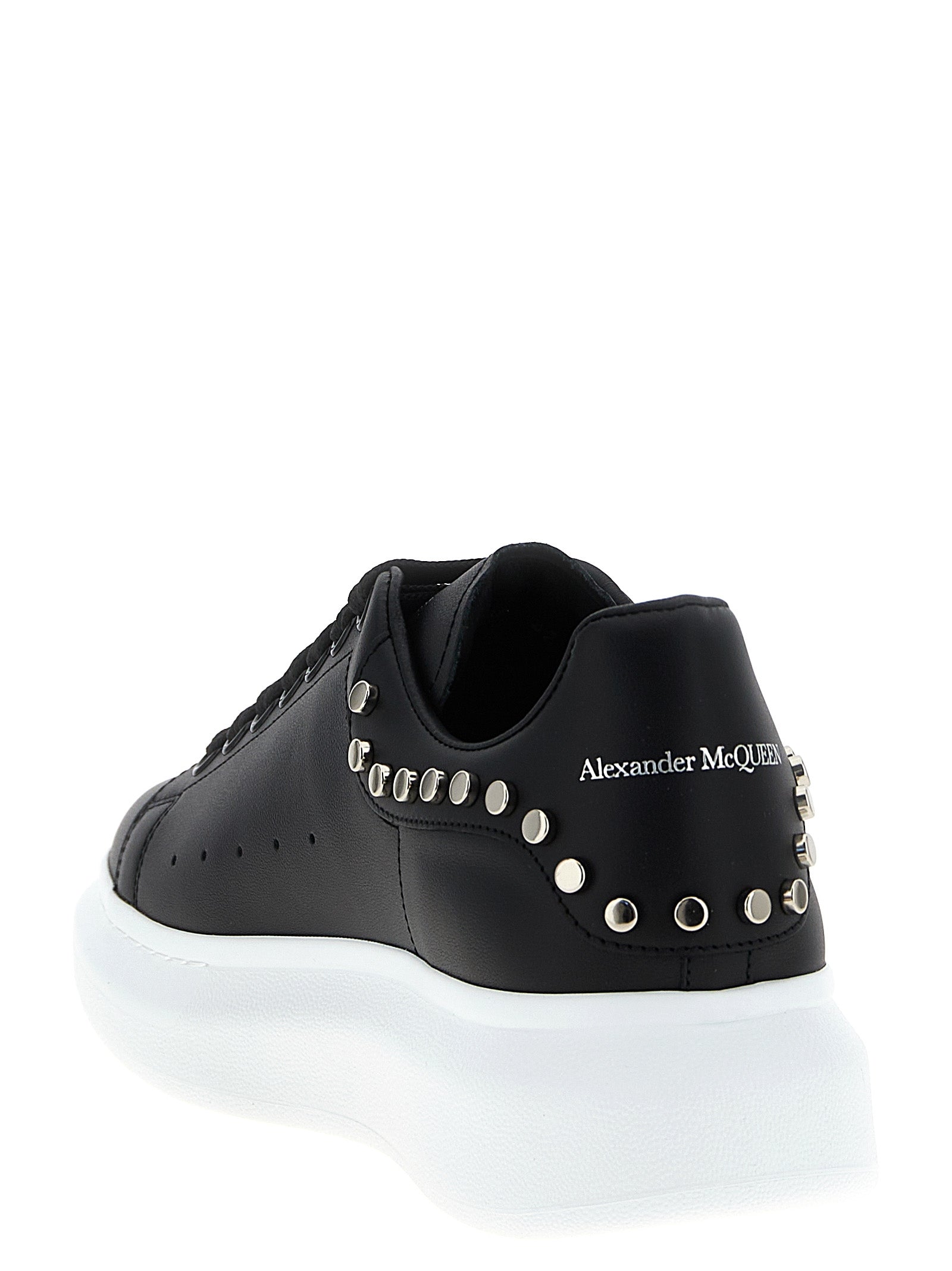 Sneakers by Alexander McQueen for men in calfskin leather black presents a sumptuous silhouette, artfully capturing the essence of the Men's Chunky Calfskin Leather Sneakers with its sumptuous chunky style design.
