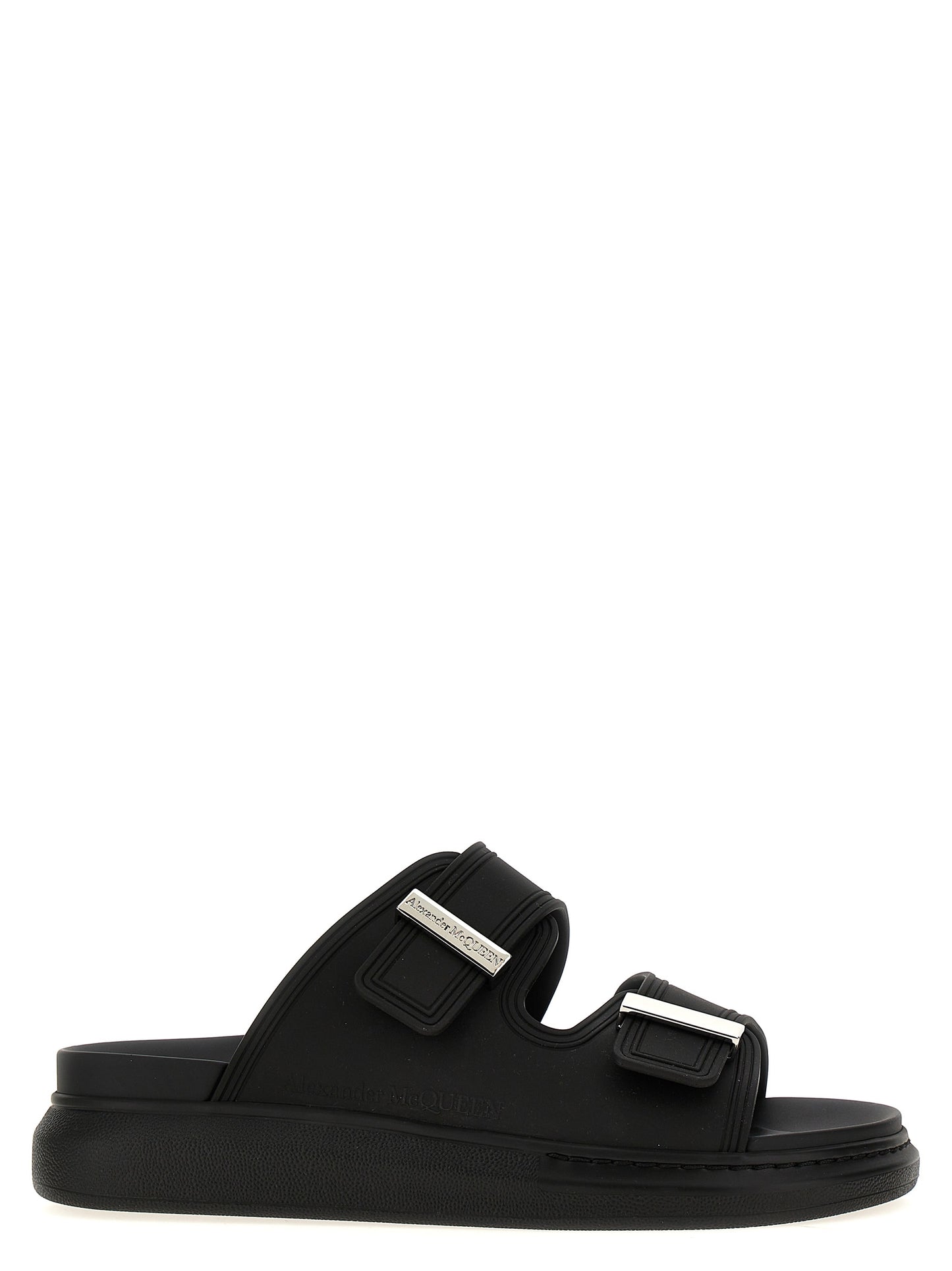 Sliders Sandals Flat Shoes by Alexander McQueen for women in rubber black presents a effortless chic silhouette, showcasing the Women's Rubber Sliders Sandals Flat Shoes design with a effortless chic and for a sophisticated look.