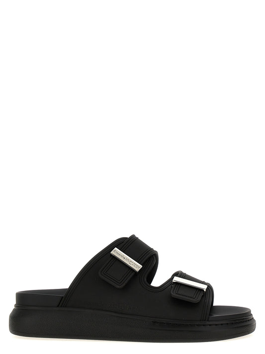 Sliders Sandals Flat Shoes by Alexander McQueen for women in rubber black presents a effortless chic silhouette, showcasing the Women's Rubber Sliders Sandals Flat Shoes design with a effortless chic and for a sophisticated look.
