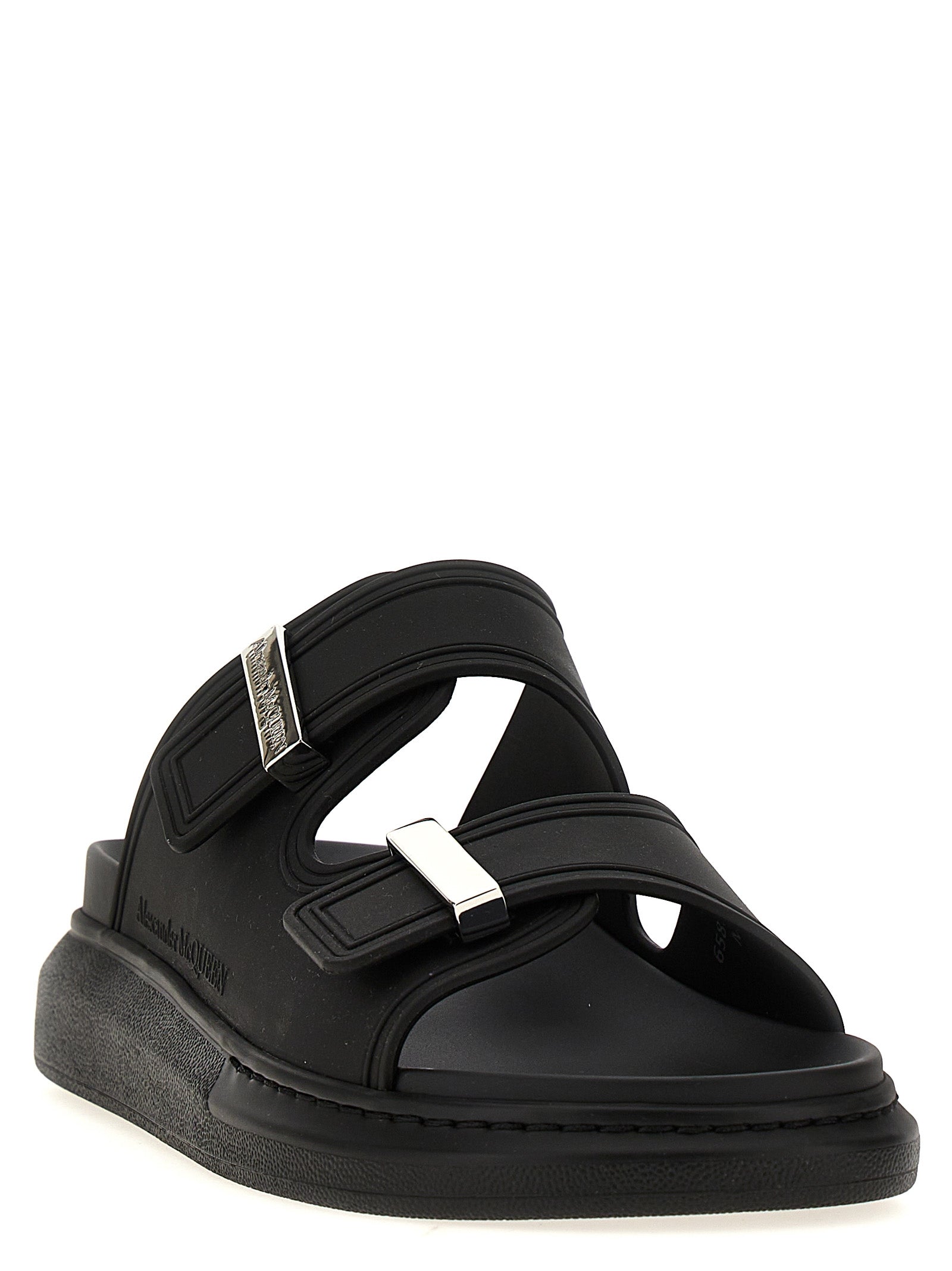 Sliders Sandals Flat Shoes by Alexander McQueen for women in rubber black showcases a resplendent Women's Rubber Sliders Sandals Flat Shoes aesthetic with a and .
