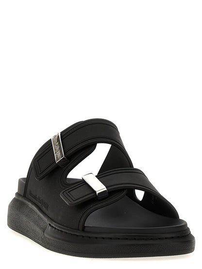 Sliders Sandals Flat Shoes by Alexander McQueen for women in rubber black showcases a resplendent Women's Rubber Sliders Sandals Flat Shoes aesthetic with a and .