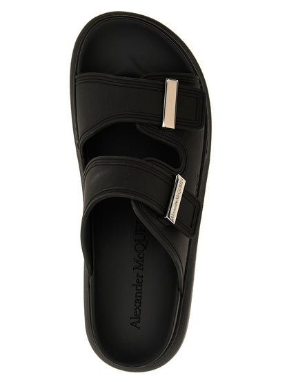 Sliders Sandals Flat Shoes by Alexander McQueen for women in rubber black features an statuesque silhouette from the Women's Rubber Sliders Sandals Flat Shoes collection, showcasing a and a statuesque for a statuesque look.