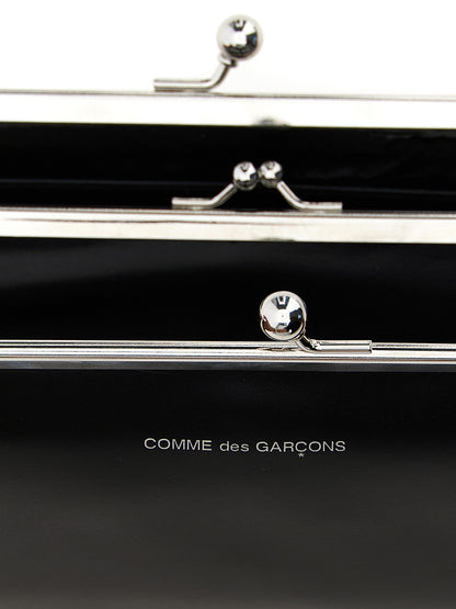Wallet by Comme Des Garçons for men in leather black presents a refined silhouette, artfully capturing the essence of the Leather Wallet design with sophisticated compact-design coin-purse for a refined look.