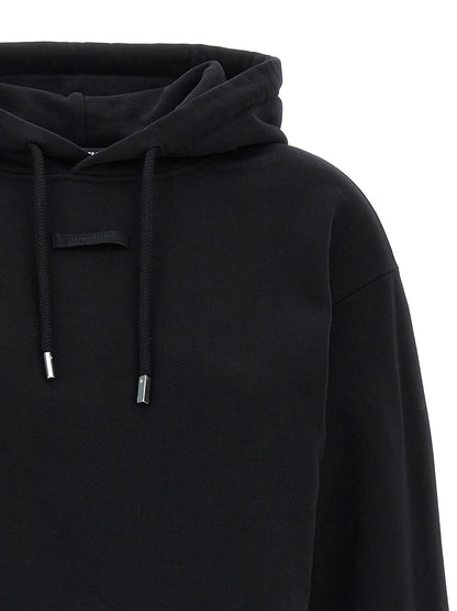 Sweatshirt Hoodie by Jacquemus for women in cotton black features an luminous silhouette, showcasing a sophisticated hooded neckline and for a truly luminous look.