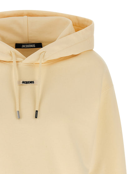 Sweatshirt Hoodie by Jacquemus for women in cotton beige features an luminous silhouette, showcasing a sophisticated hooded neckline and for a truly luminous look.