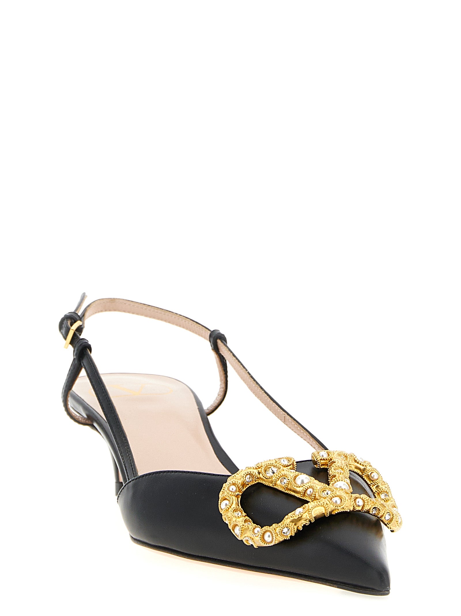 Mid-Heel Slingback Pumps Heels by Valentino Garavani for women in calfskin leather black & signature features a effortless chic silhouette, showcasing the V Logo Women's Calfskin Leather Mid-Heel Slingback Pumps Heels design with a effortless chic mid-heel and pointed toe style for a effortless chic finish.