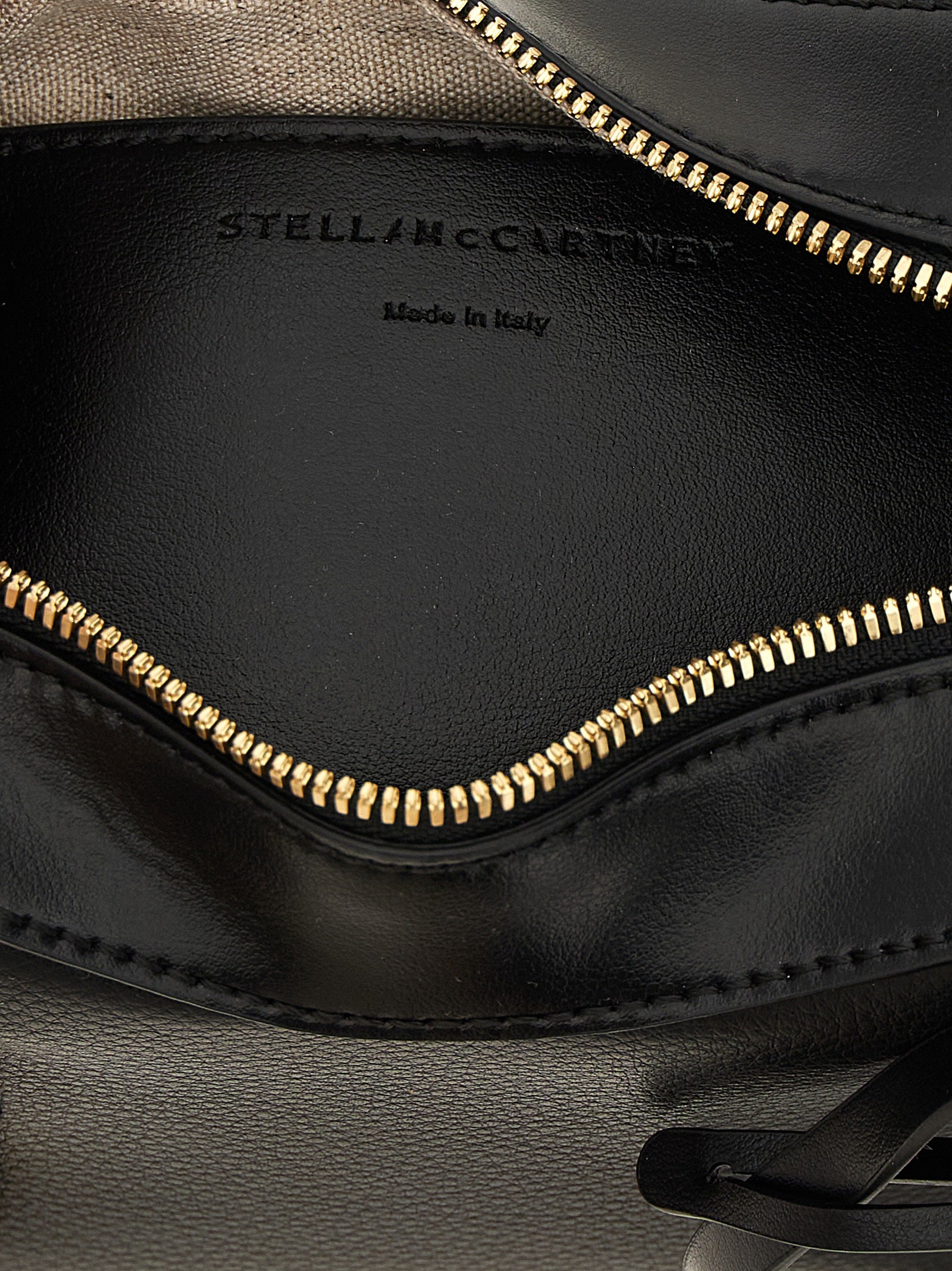 Crossbody Handbag by Stella McCartney for women in polyamide polyurethane leather black features a versatile chic silhouette, meticulously detailed with a secure zipper, ample , and versatile crossbody-strap, shoulder-strap, adjustable-strap & handle.