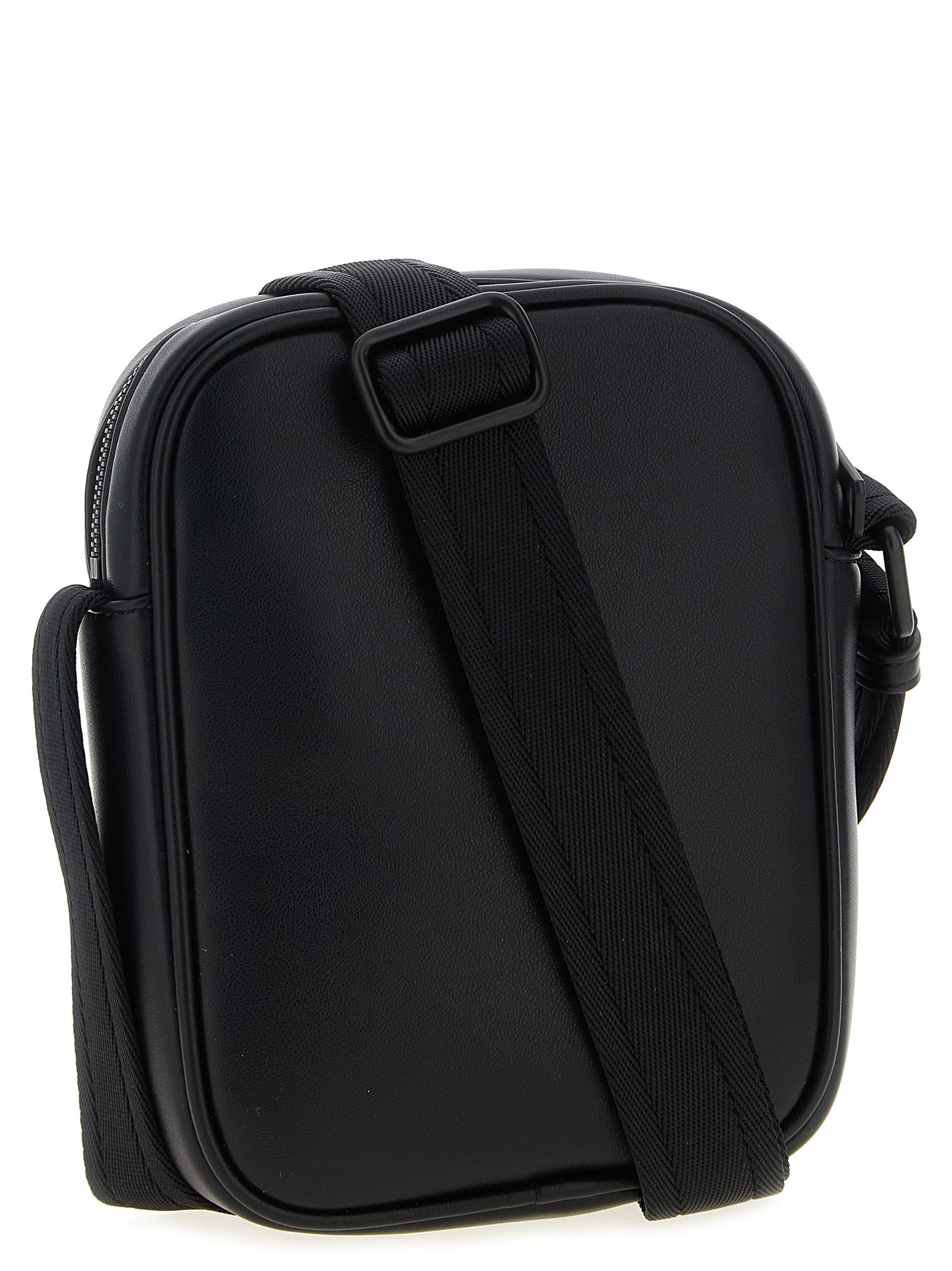 Crossbody Oval Handbag by Diesel for women in polyurethane leather black & signature features a transformative sophistication silhouette, showcasing a secure zipper, ample , and versatile crossbody-strap, shoulder-strap & adjustable-strap for a transformative sophistication look.