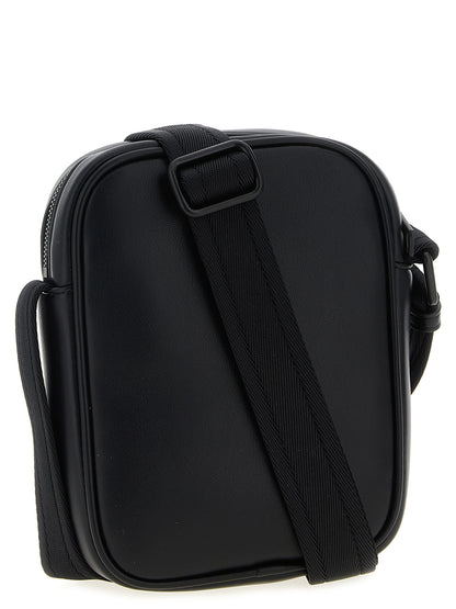 Crossbody Oval Handbag by Diesel for women in polyurethane leather black & signature features a transformative sophistication silhouette, showcasing a secure zipper, ample , and versatile crossbody-strap, shoulder-strap & adjustable-strap for a transformative sophistication look.