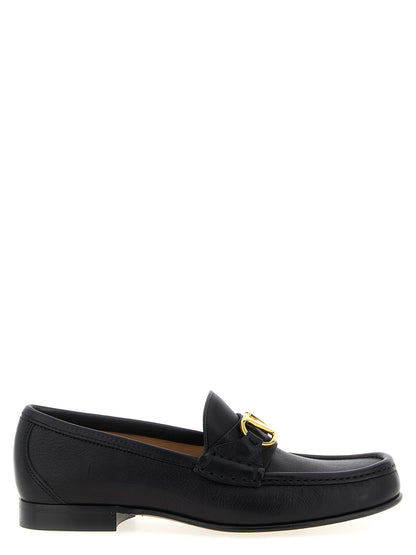 Flat Loafer Slip-On Shoes by Valentino Garavani for women in buffalo leather black & signature features an ergonomic silhouette, perfectly showcasing V Logo Women's Buffalo Leather Flat Loafer Slip-On Shoes with its distinct flat and elegant .