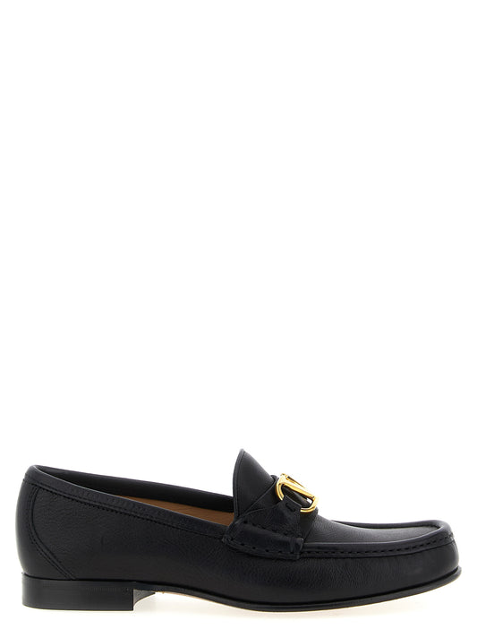 Flat Loafer Slip-On Shoes by Valentino Garavani for women in buffalo leather black & signature features an ergonomic silhouette, perfectly showcasing V Logo Women's Buffalo Leather Flat Loafer Slip-On Shoes with its distinct flat and elegant .
