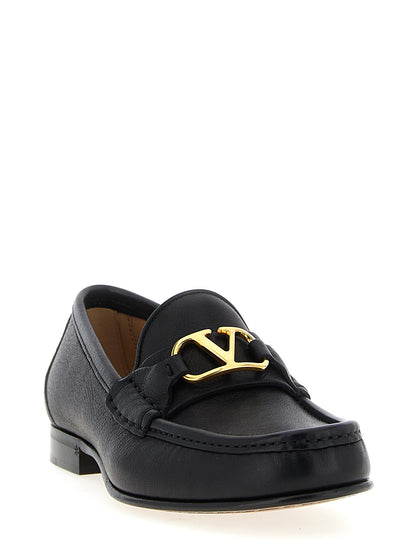 Flat Loafer Slip-On Shoes by Valentino Garavani for women in buffalo leather black & signature showcases a resplendent V Logo Women's Buffalo Leather Flat Loafer Slip-On Shoes aesthetic, defined by its resplendent and elegant flat.