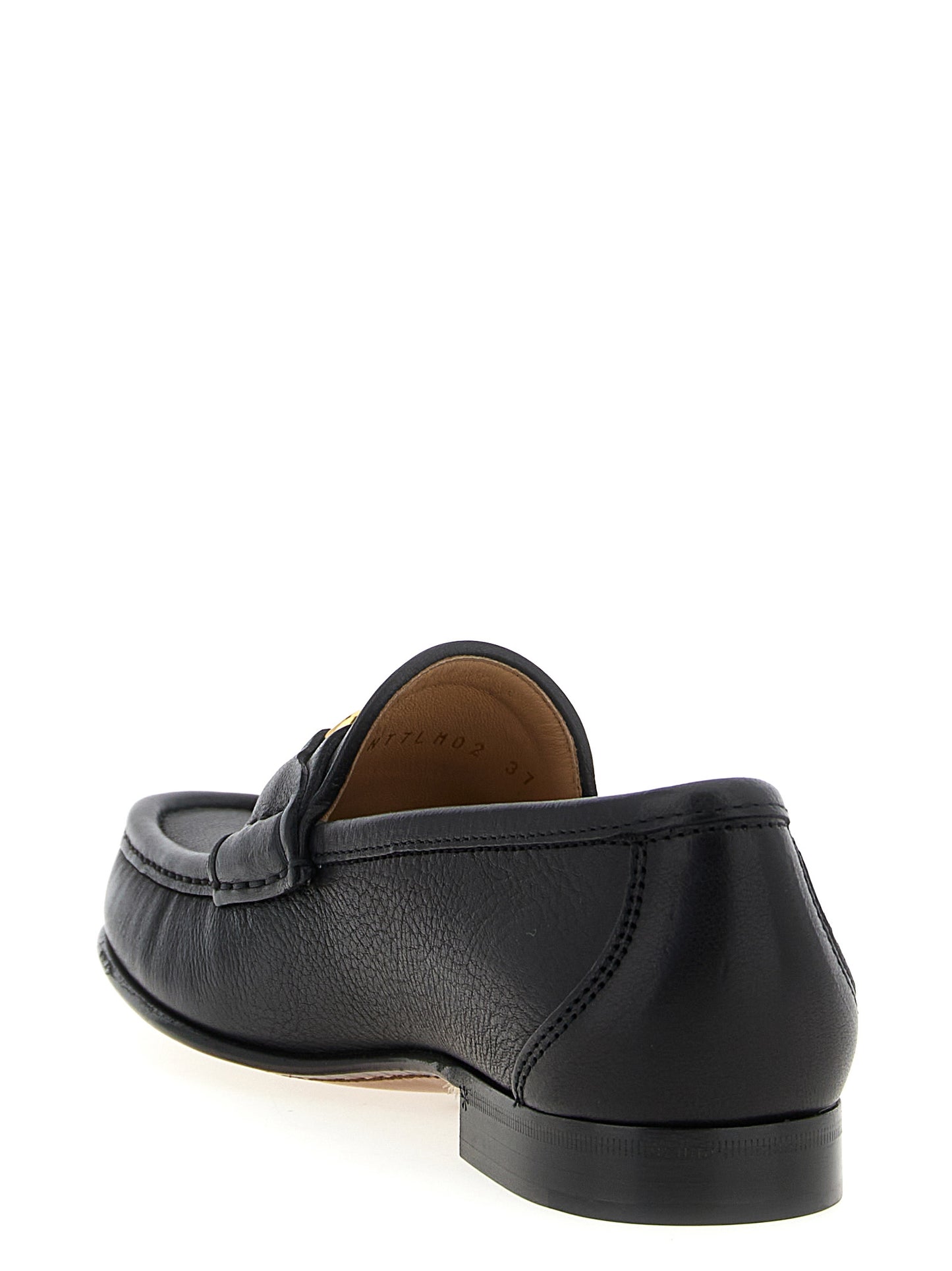Flat Loafer Slip-On Shoes by Valentino Garavani for women in buffalo leather black & signature showcases a timeless silhouette from the V Logo Women's Buffalo Leather Flat Loafer Slip-On Shoes collection, featuring a timeless flat and for a timeless finish.