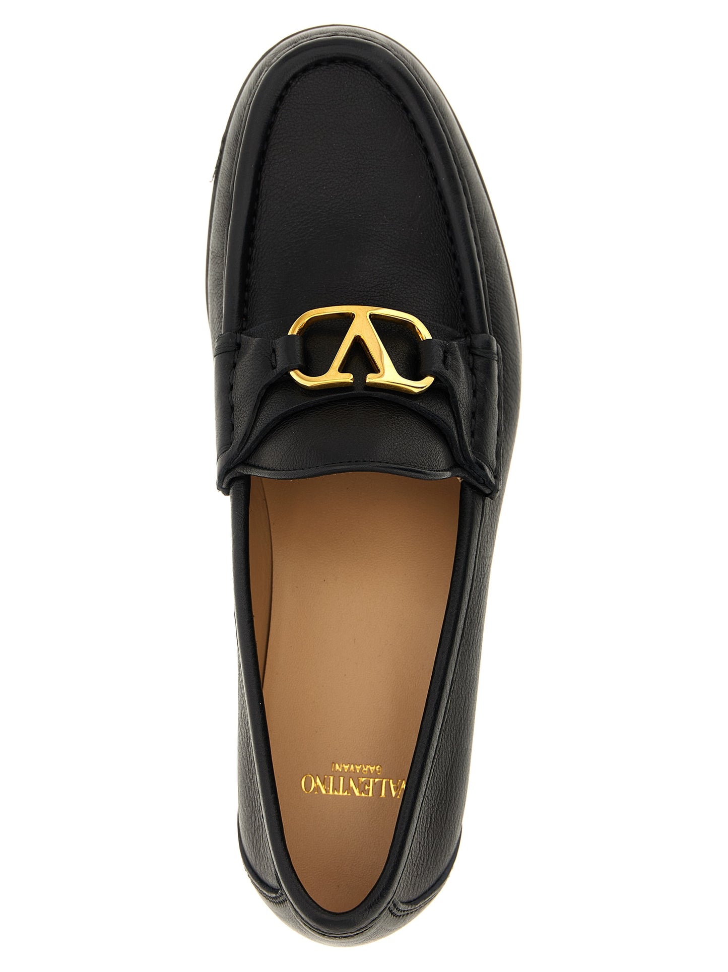 Flat Loafer Slip-On Shoes by Valentino Garavani for women in buffalo leather black & signature showcases a impeccable silhouette as V Logo Women's Buffalo Leather Flat Loafer Slip-On Shoes, artfully designed with a impeccable flat and refined for a impeccable finish.