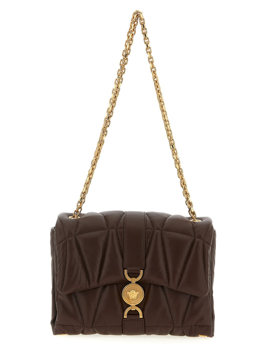 Quilted Shoulder Flap Bag by Versace for women in lamb leather brown features an effortlessly chic silhouette with a secure flap & magnetic, ample , and versatile shoulder-strap for effortlessly chic everyday luxury.
