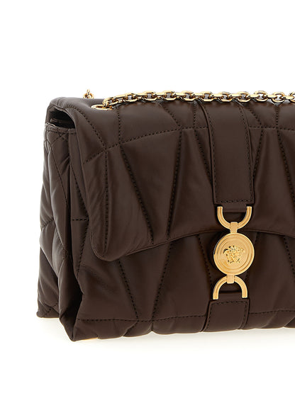 Quilted Shoulder Flap Bag by Versace for women in lamb leather brown features a stately silhouette, showcasing a secure flap & magnetic, ample , and stately shoulder-strap for a stately finish.