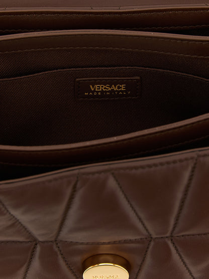 Quilted Shoulder Flap Bag by Versace for women in lamb leather brown features a effortless sophistication silhouette, secured by a flap & magnetic with ample and versatile shoulder-strap for a effortless sophistication finish.