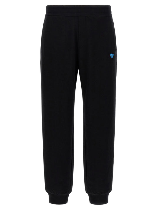 Joggers by Versace for men in cotton black & signature features a polished silhouette with a polished , reaching a polished long and finished with a polished .