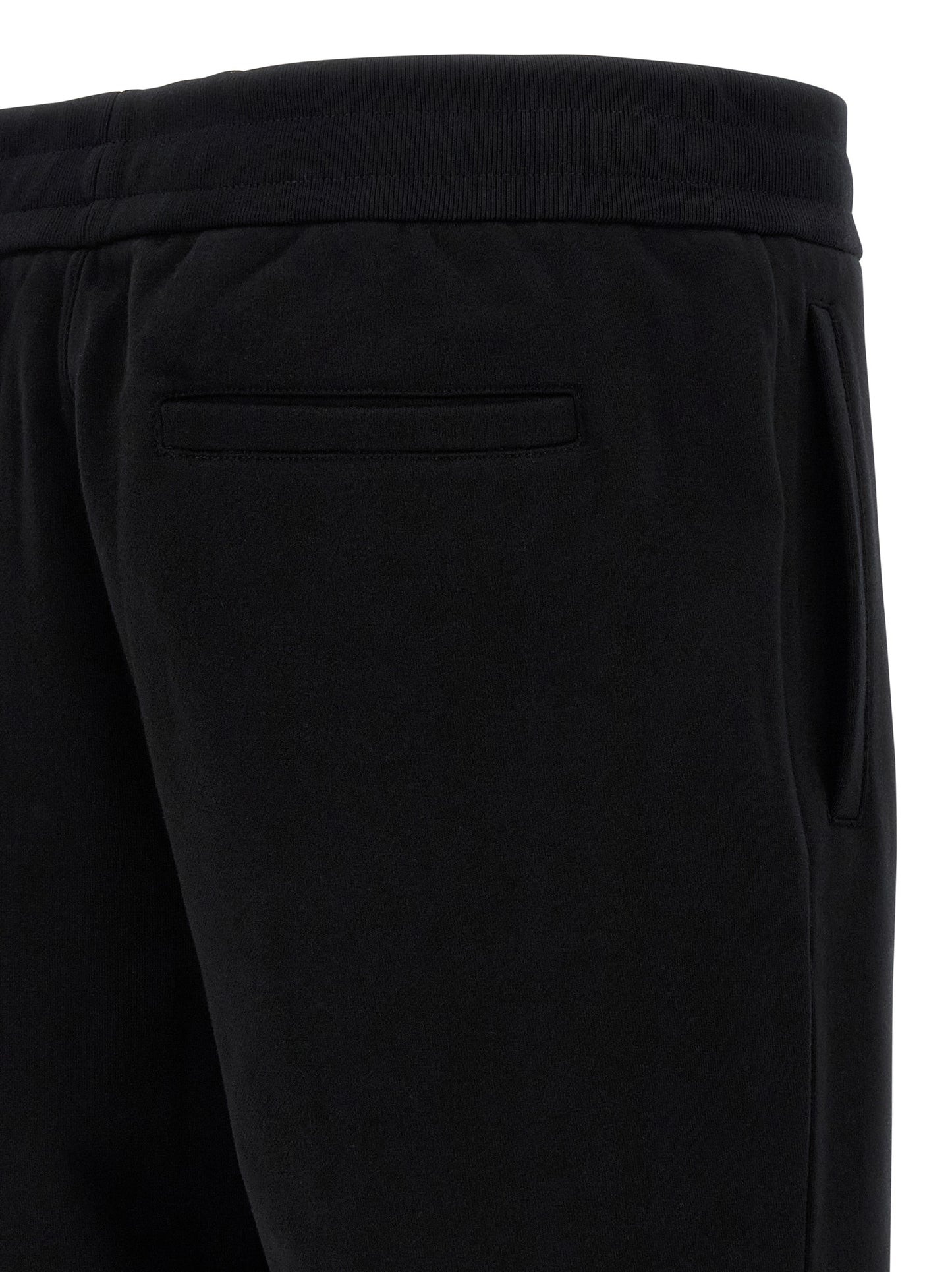 Joggers by Versace for men in cotton black & signature presents a tailored silhouette, showcasing a tailored and long cut with a refined for a truly tailored aesthetic.