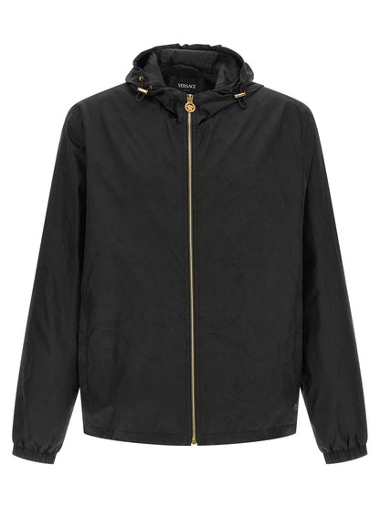 Hooded Windbreaker Jacket by Versace for men in nylon black, patterned & jacquard presents a resilient silhouette, artfully detailed with a sophisticated hooded neckline and functional hooded & windproof for a resilient finish.