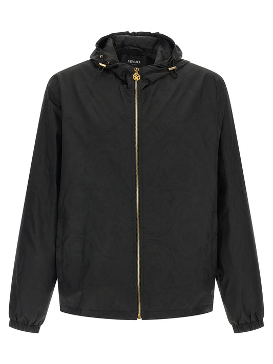 Hooded Windbreaker Jacket by Versace for men in nylon black, patterned & jacquard presents a resilient silhouette, artfully detailed with a sophisticated hooded neckline and functional hooded & windproof for a resilient finish.