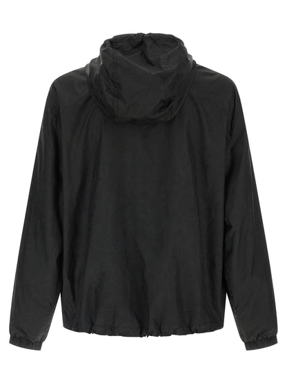 Hooded Windbreaker Jacket by Versace for men in nylon black, patterned & jacquard features an perennial silhouette with a refined hooded neckline and perennial hooded & windproof for a sophisticated weather-resistant look.