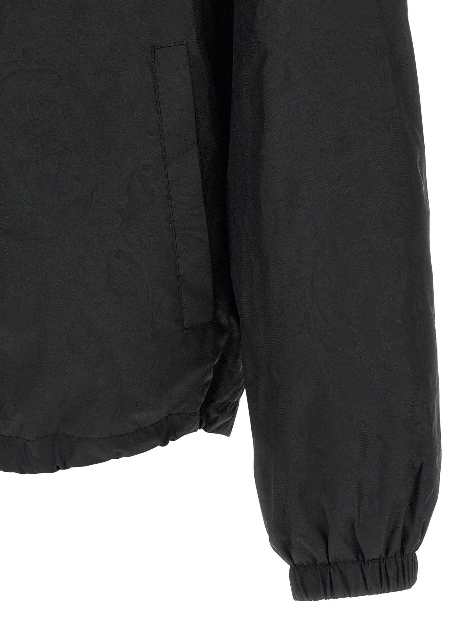 Hooded Windbreaker Jacket by Versace for men in nylon black, patterned & jacquard features an enduring silhouette, showcasing technical hooded & windproof and a sophisticated for a truly enduring aesthetic.