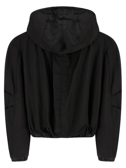 This Hooded Bomber Jacket by The Attico for women in nylon black exhibits a edgy silhouette, meticulously detailed with functional hooded and a edgy hooded neckline for a edgy finish.