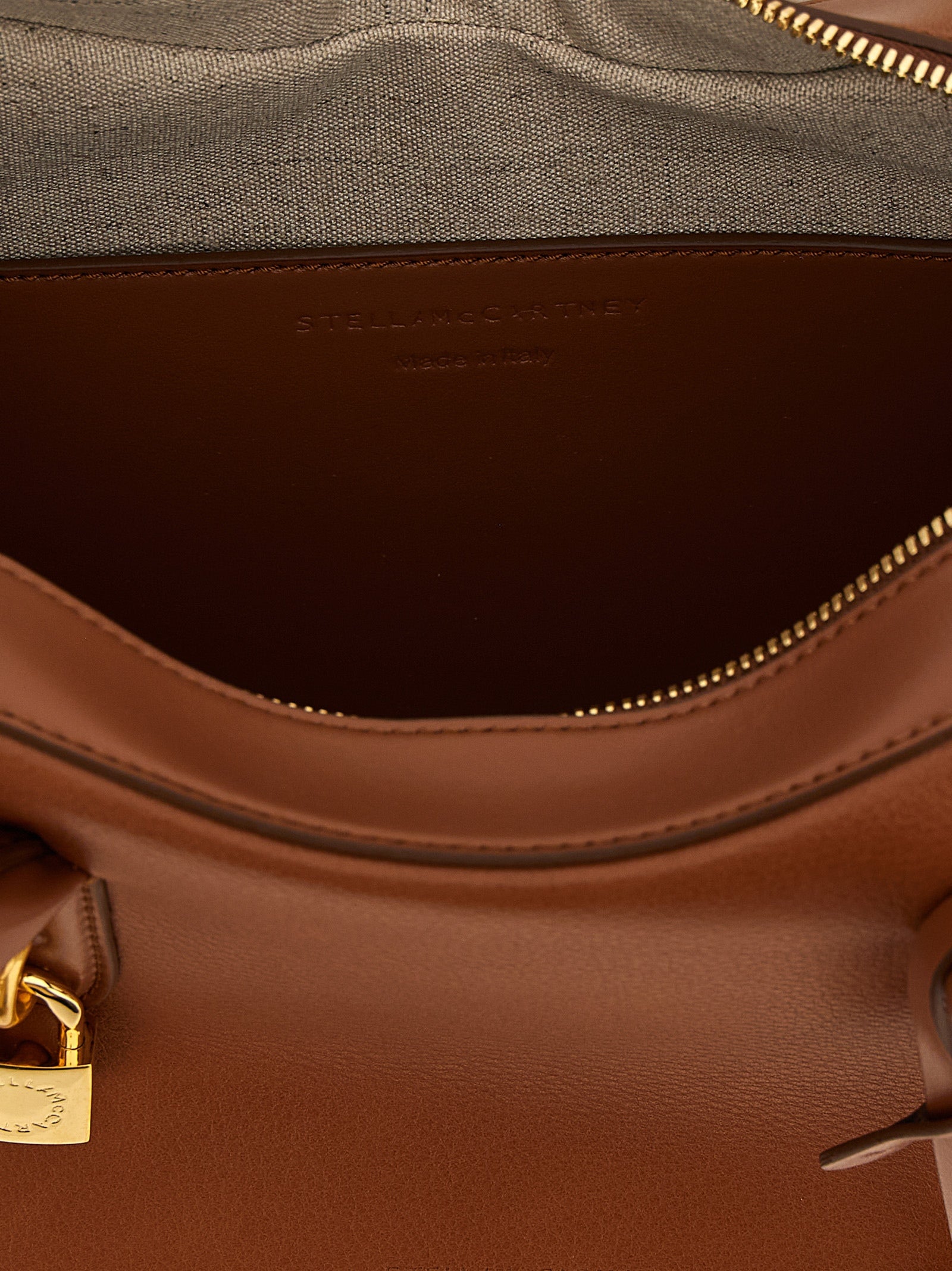 Shoulder Bag by Stella McCartney for women in polyurethane leather brown features an effortlessly chic silhouette with a secure zipper, ample , and versatile shoulder-strap & handle for effortlessly chic everyday luxury.