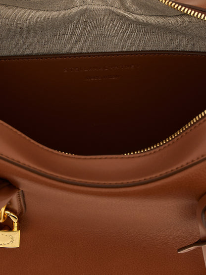Shoulder Bag by Stella McCartney for women in polyurethane leather brown features an effortlessly chic silhouette with a secure zipper, ample , and versatile shoulder-strap & handle for effortlessly chic everyday luxury.