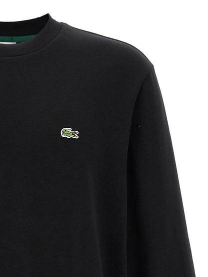 Sweatshirt by Lacoste for men in cotton polyester black features an enviable silhouette, showcasing a premium and refined crew neckline for a truly enviable finish.