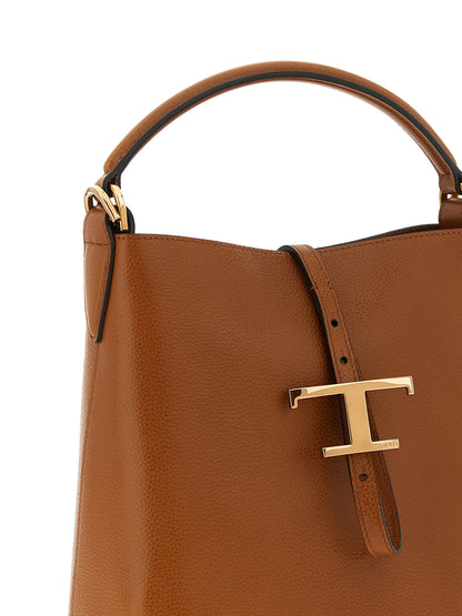Large Crossbody Bucket Handbag by Tod's for women in calfskin leather brown features a contemporary silhouette, showcasing a secure snap & button, ample , and contemporary crossbody-strap, shoulder-strap, adjustable-strap & handle for a sophisticated look.