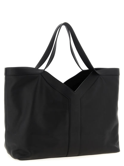 Large Shopper Tote Bag by Saint Laurent for men in suede calfskin leather black features an sumptuous Suede Calfskin Leather Large Shopper Tote Bag design with a secure snap & hook, ample , and versatile handle for an sumptuous finish.