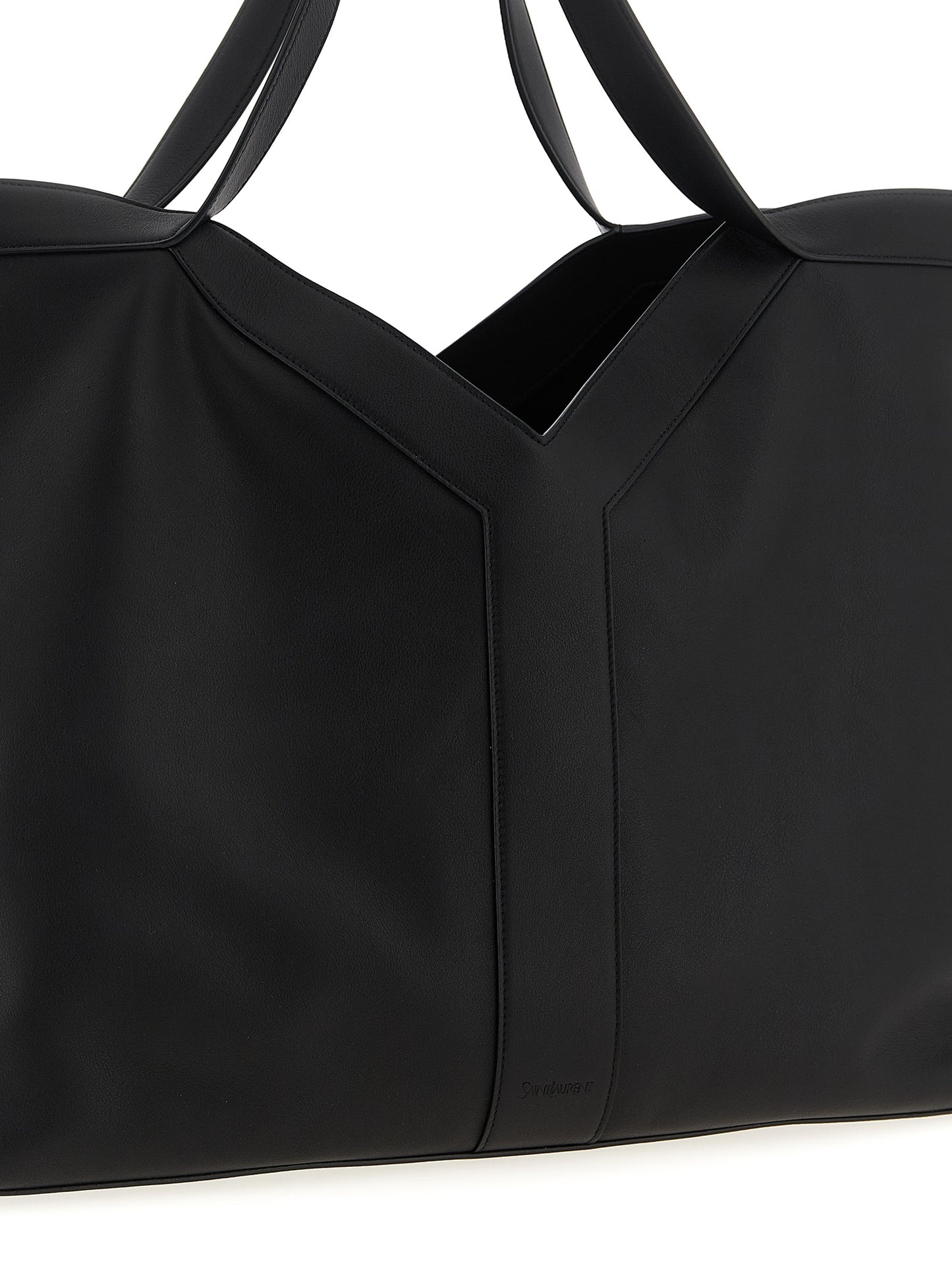 This Large Shopper Tote Bag by Saint Laurent for men in suede calfskin leather black features an on trend Suede Calfskin Leather Large Shopper Tote Bag design with a secure snap & hook, ample , and on trend handle.