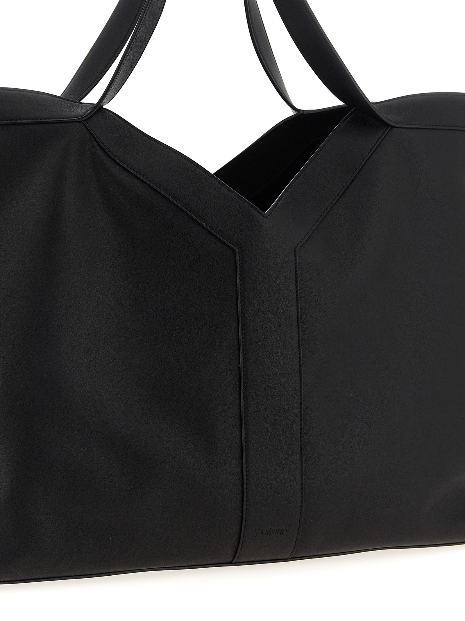 This Large Shopper Tote Bag by Saint Laurent for men in suede calfskin leather black features an on trend Suede Calfskin Leather Large Shopper Tote Bag design with a secure snap & hook, ample , and on trend handle.