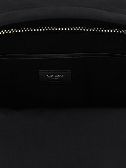 Backpack by Saint Laurent for men in polyamide patent leather black features a utilitarian chic Polyamide Patent Leather Backpack design with a secure zipper, ample , and versatile handle, backpack-strap & adjustable-strap for a utilitarian chic finish.
