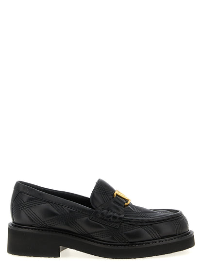 Flat Loafer Slip-On Shoes by Valentino Garavani for women in lamb leather black & signature features an dynamic silhouette from the V Logo Women's Lamb Leather Flat Loafer Slip-On Shoes collection, defined by a dynamic and flat for a dynamic look.