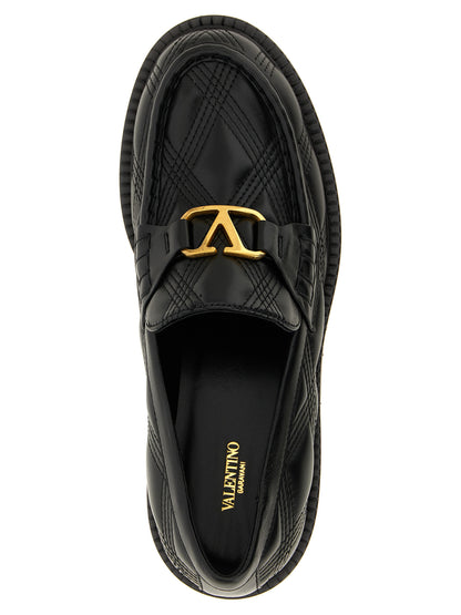 Flat Loafer Slip-On Shoes by Valentino Garavani for women in lamb leather black & signature features an ergonomic silhouette, perfectly showcasing V Logo Women's Lamb Leather Flat Loafer Slip-On Shoes with its distinct flat and elegant .