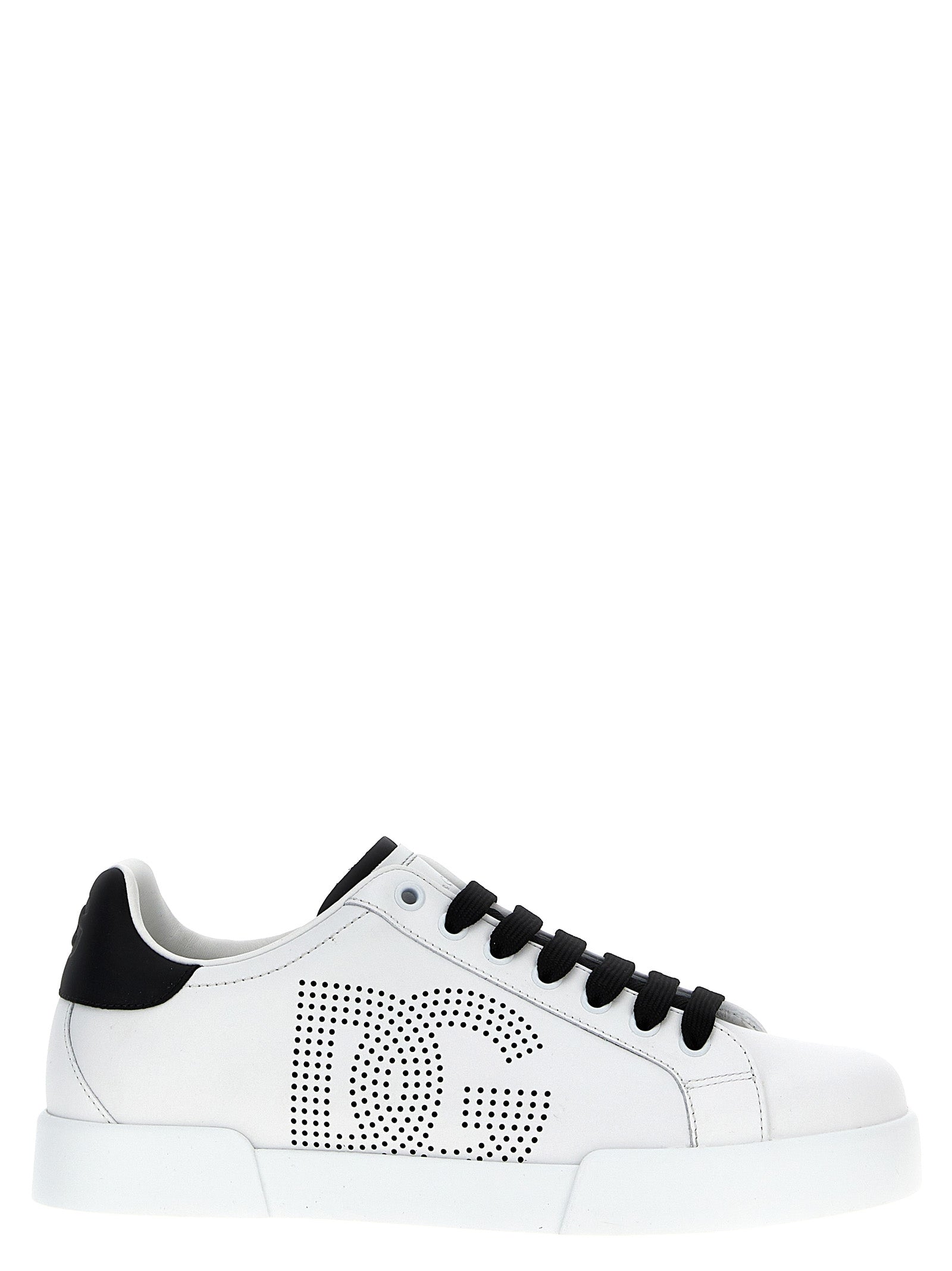 Sneakers by Dolce & Gabbana for men in bos taurus calfskin leather bicolour, black & white presents a sumptuous silhouette, artfully capturing the essence of the Men's Low Top Bos Taurus Calfskin Leather Sneakers with its sumptuous low-top style design.